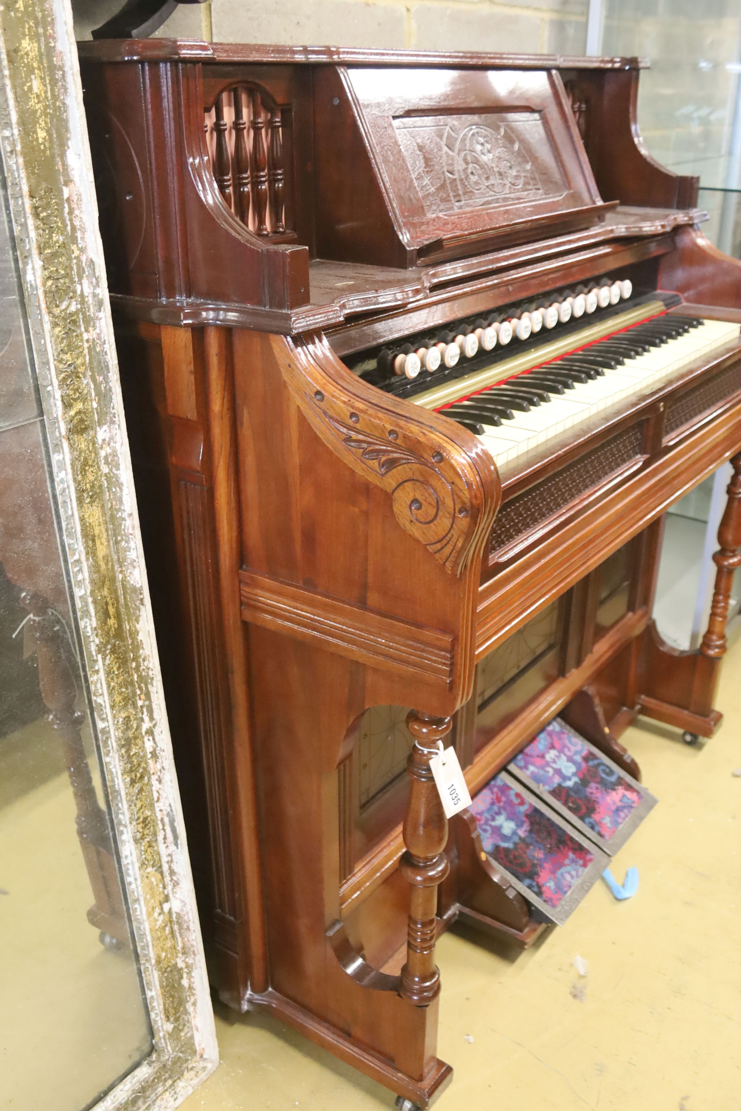 A late Victorian mahogany harmonium, width 120cm, depth 60cm, height 130cm